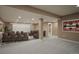 Basement home theater with large screen and seating at 59304 E Commanche Way, Strasburg, CO 80136