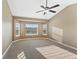Main bedroom with bay window and ceiling fan at 59304 E Commanche Way, Strasburg, CO 80136