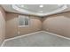 Finished basement bedroom with window and neutral carpeting at 59304 E Commanche Way, Strasburg, CO 80136