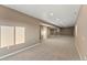Spacious finished basement with neutral carpeting at 59304 E Commanche Way, Strasburg, CO 80136
