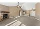 Living room with a fireplace and neutral color palette at 59304 E Commanche Way, Strasburg, CO 80136