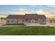 Ranch-style home with green exterior and landscaping at 59304 E Commanche Way, Strasburg, CO 80136