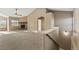 View of staircase leading upstairs from the living area at 59304 E Commanche Way, Strasburg, CO 80136