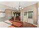 Sunlit dining room with hardwood floors and access to patio at 59304 E Commanche Way, Strasburg, CO 80136