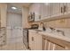 White cabinets and quartz countertops in kitchen at 2 Adams St # 1204, Denver, CO 80206
