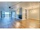 Open concept living and dining area with hardwood floors at 2 Adams St # 1204, Denver, CO 80206