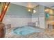 Relaxing hot tub area with tiled walls at 2 Adams St # 1204, Denver, CO 80206