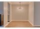 Bright dining room with hardwood floors and modern chandelier at 2 Adams St # 1204, Denver, CO 80206