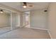 Bedroom with mirrored closet and access to bathroom at 2 Adams St # 1204, Denver, CO 80206