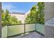 Private balcony overlooking a lush green courtyard at 2312 S University Blvd, Denver, CO 80210