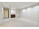 Open basement area with wet bar and carpeted floors at 2312 S University Blvd, Denver, CO 80210