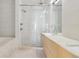 Modern bathroom with double vanity and a large glass shower at 2312 S University Blvd, Denver, CO 80210