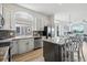 Modern kitchen with stainless steel appliances and granite countertops at 1949 Spruce Ct, Erie, CO 80516