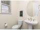 Clean bathroom with pedestal sink and updated fixtures at 12897 Creekwood St, Firestone, CO 80504