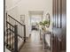 Bright entryway with wooden floors and stairs leading to the second floor at 12897 Creekwood St, Firestone, CO 80504