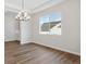 Dining room with a modern chandelier and view of the neighboring houses at 5075 Hickory Oaks St, Castle Rock, CO 80104