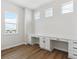 Bright home office with built-in white desk, dual workstations, and large windows at 5075 Hickory Oaks St, Castle Rock, CO 80104