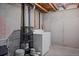 Unfinished basement laundry area with washer and dryer hookups at 930 Button Rock Dr # J59, Longmont, CO 80504