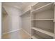 Large walk-in closet with hanging rods and shelving at 930 Button Rock Dr # J59, Longmont, CO 80504