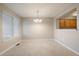 Simple dining area with light walls and kitchen access at 930 Button Rock Dr # J59, Longmont, CO 80504