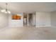 Bright dining area with carpet, light walls, and kitchen pass-through at 930 Button Rock Dr # J59, Longmont, CO 80504