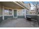 Front entry of townhome with covered porch and green door at 930 Button Rock Dr # J59, Longmont, CO 80504