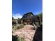 Back of house with patio, landscaping, and access to backyard at 757 S Vine St, Denver, CO 80209