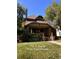 Brick house with a classic design, landscaped yard, and inviting front porch at 757 S Vine St, Denver, CO 80209