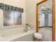 Bathroom with soaking tub and walk-in closet access at 5123 Red Oak Way, Parker, CO 80134