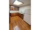 Kitchen with wood cabinets, granite countertops, and a skylight at 3273 S Florence Ct, Denver, CO 80231