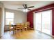 Dining room with wood table and chairs, and sliding glass doors to backyard at 3342 W 114Th Pl, Westminster, CO 80031