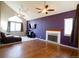 Living room with hardwood floors, fireplace, and vaulted ceiling at 3342 W 114Th Pl, Westminster, CO 80031