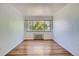 Bedroom with hardwood floors and large window at 85 N Grant St # 22, Denver, CO 80203