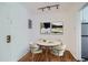 Small dining area with round table and four chairs at 85 N Grant St # 22, Denver, CO 80203