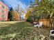Landscaped backyard with lawn, trees, and seating at 85 N Grant St # 22, Denver, CO 80203