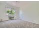 Bright bedroom with window, closet, and carpeted floor at 85 N Grant St # 22, Denver, CO 80203