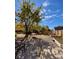 Spacious backyard with gravel, trees, and garden at 85 N Grant St # 22, Denver, CO 80203