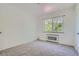 Simple bedroom with neutral walls and carpeted floor at 85 N Grant St # 22, Denver, CO 80203