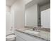 Clean bathroom with granite countertop and a mirror at 2460 Christina St, Fort Lupton, CO 80621