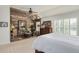 Main bedroom with sitting area and wood accent wall at 9502 Silver Spur Ln, Highlands Ranch, CO 80130