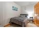 Cozy bedroom with a double bed, nightstand, and ample closet space at 24087 Deer Valley Rd, Golden, CO 80401
