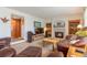 Bright living room with a fireplace and comfortable leather furniture at 24087 Deer Valley Rd, Golden, CO 80401