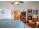 Main bedroom with a king-size bed and access to the bathroom at 24087 Deer Valley Rd, Golden, CO 80401