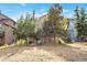 Back of house, showing a two-story home with landscaping at 24087 Deer Valley Rd, Golden, CO 80401