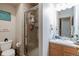 Updated bathroom with a shower/tub combo, vanity, and toilet at 24087 Deer Valley Rd, Golden, CO 80401
