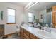Bathroom with double sinks and a walk-in shower at 24087 Deer Valley Rd, Golden, CO 80401