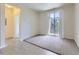 Living room with sliding glass doors to balcony at 4100 Albion St # 512, Denver, CO 80216