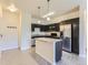 Modern kitchen with stainless steel appliances and island at 4100 Albion St # 512, Denver, CO 80216