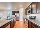 Spacious kitchen with granite countertops and stainless steel appliances at 5721 Echo Park Cir, Castle Rock, CO 80104