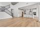 Open concept kitchen with island, white cabinets, and stainless steel appliances at 3391 N Buchanan Way, Aurora, CO 80019